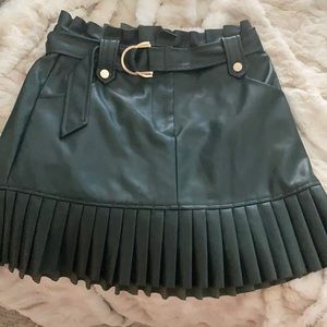 Emerald green faux leather pleated mini skirt